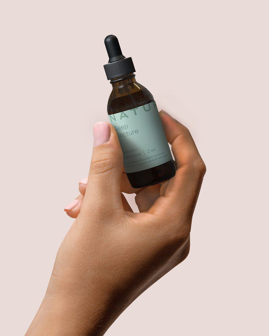 Sanatura sleep tincture held in hand