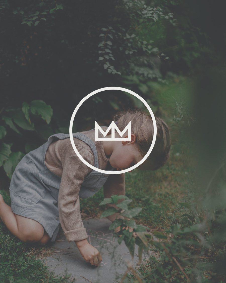 Mountain Movers crown mark over a child playing outside