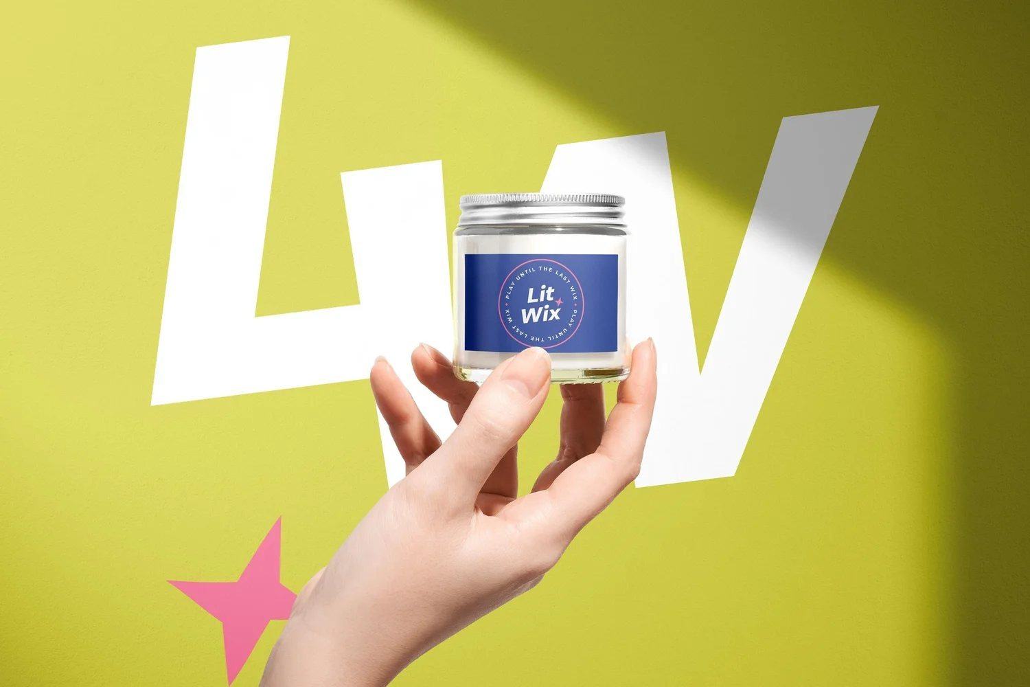 Lit Wix candle brand held against a bright yellow backdrop